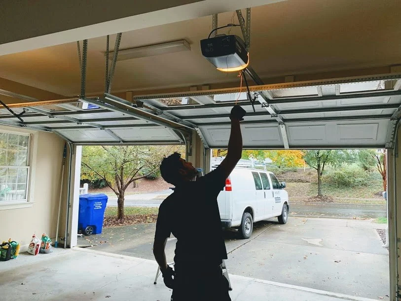 echnician repairing a stuck garage door in Mercer Island